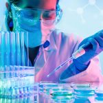 Woman pipetting into a petri dish