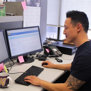 Man in front of computer with Knowledge Navigator on his screen