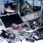 heap of old computers and old devices piled up