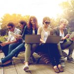 students with laptop computers