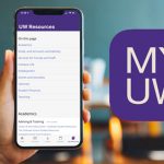 A hand holding a smart phone with the MyUW app displayed on screen.