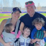 Group photo of the Brodsky family at a baseball game.